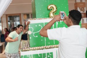 "lemme pose infront of this cupcake tower"