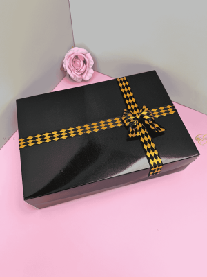Black gift box E with gold speckled ribbon